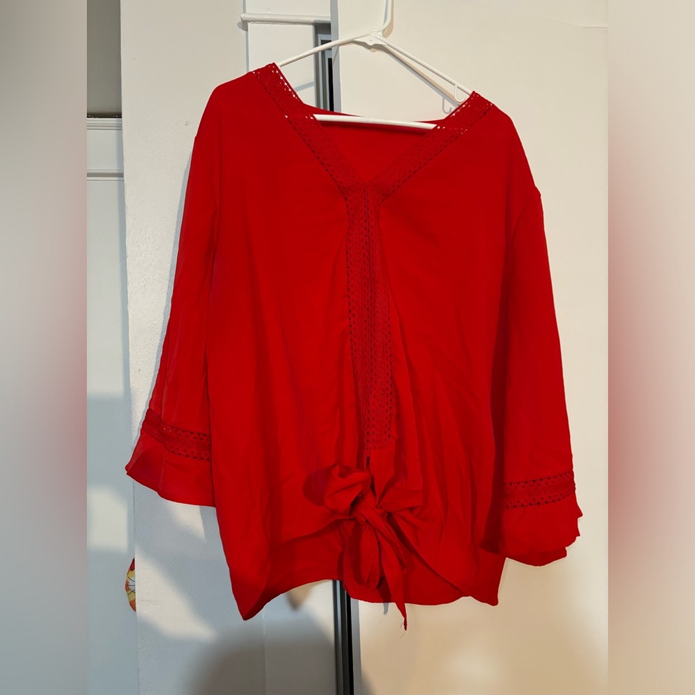 Tie front blouse with bell sleeves.